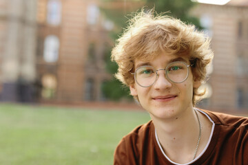 Portrait eye contact Zoomer appearance courtyard off time teenager