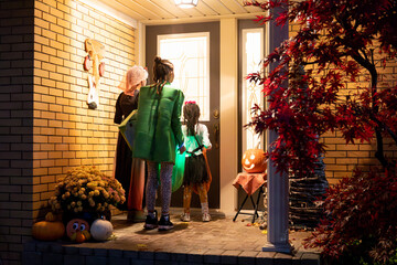 Kids out trick or treating on Halloween