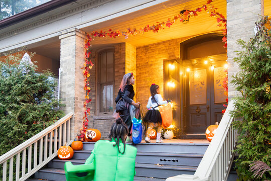Kids out trick or treating on Halloween