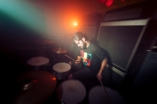 Drummer having fun playing at nightclub