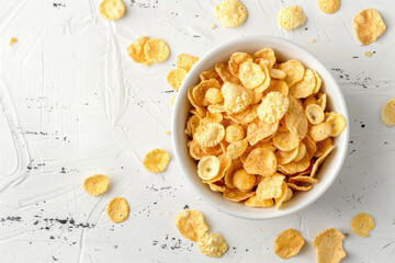 Top view of cornflakes in a white bowl on the table