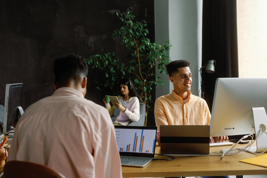 Up-to-date co-working office team technology workstation business 