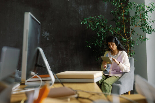 Businesswoman browse tablet wireless headset office break management