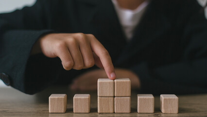 Blank wooden cubes on the table with copy space, empty wooden cubes for input wording, and an infographic icon