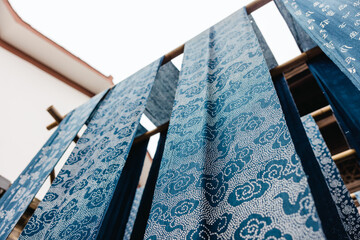 drying traditional dyed cloth by hanging outdoor