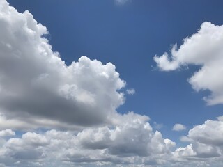 Fototapeta premium Sky filled with fluffy white clouds on a bright summer day