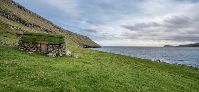 Seaside Shepherd's Stone Hut on Mountain Slope, overlooking the Sea
