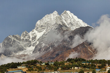 Thamserku twin peaks at 6608 meters shine bright in the morning sun, presenting a magnificent view as it towers above the sherpa market town of Namche Bazaar in the high Himalayas of Khumbu, Nepal © InnerPeace
