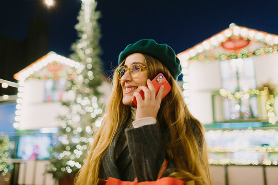 A woman doing a call at a Christmas Market