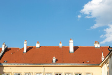 Chimneys on the roof of the house against the sky