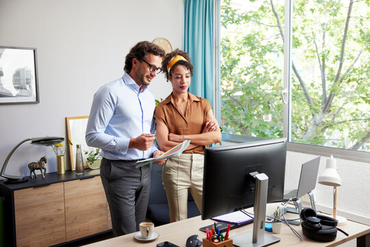 Diverse coworkers working on project in office