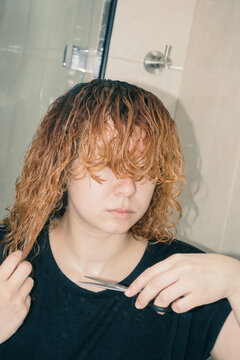 Woman cutting her hair