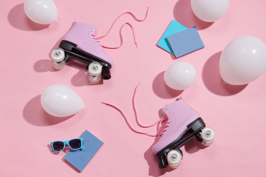 Vintage roller skates on color background