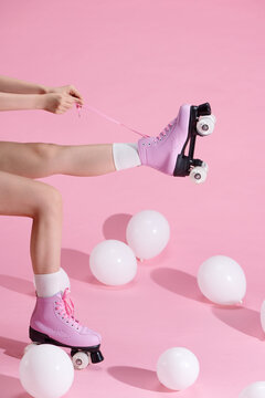 Legs wearing cute sweet with shoelaces four wheeled roller