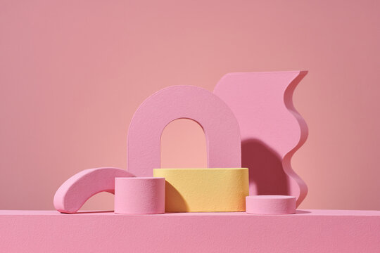 podium with geometric shapes on pink background, arch and stage