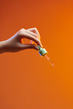 Pipette dropper with a drop of natural oil