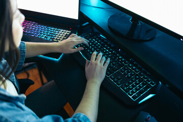 Close-up detail of a girl using a computer keyboard