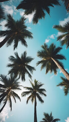 Fototapeta na wymiar Tropical palm trees against a clear blue sky, conveying a sense of summer and relaxation.