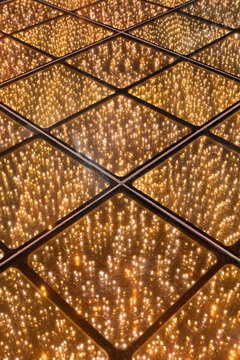 Symmetric floor illuminated with bright golden lights