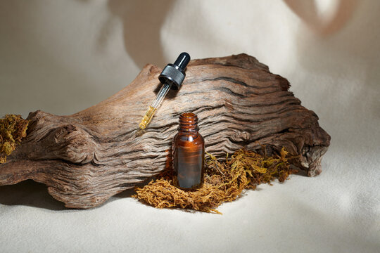 Bottle of dark amber glass with hyaluronic acid or face serum