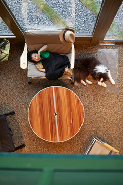 Asian little girl, playing in the living room. Overhead angle
