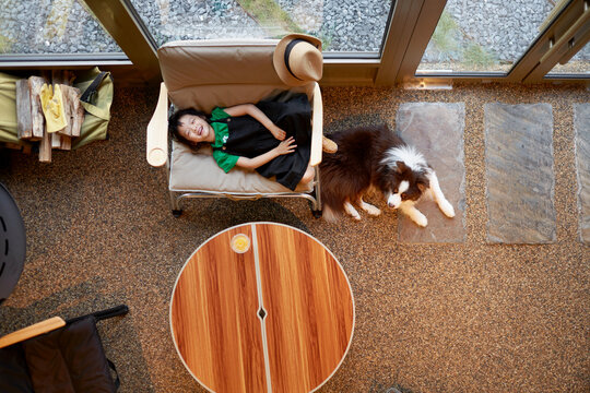 Asian little girl, playing in the living room. Overhead angle