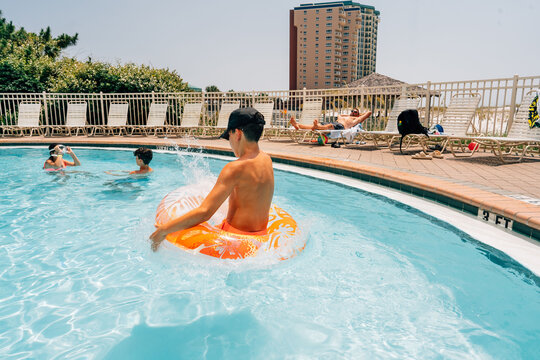 Family lounging around the pool. 