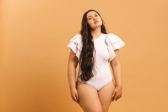 Embracing Every Curve: Confident Plus Size Model Looking At the Camera