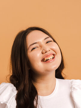 Natural portrait of young woman in studio 
