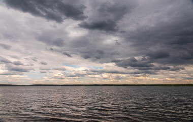 Blue lake with cloudy sky, natural background