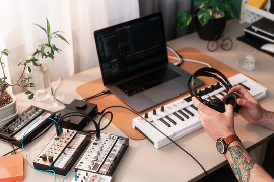 Close Up Of Anonymous Man Holding Headphones