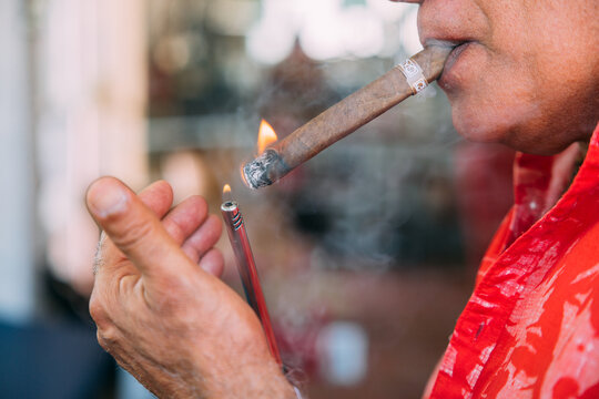 Senior cuban man smoking cigar