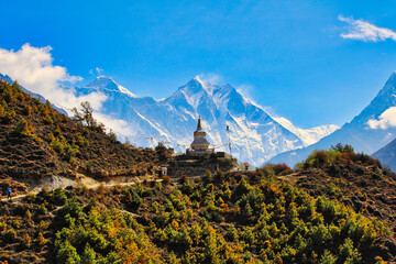 Mount Everest and Lhotse with the Tenzing Memorial Chorten in the foreground present a memorable image for trekkers on the Everest base camp trek near Namche Bazaar,Nepal - obrazy, fototapety, plakaty