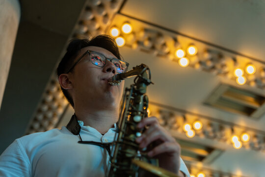 Talentend Man Playing The Saxophone On The Street.