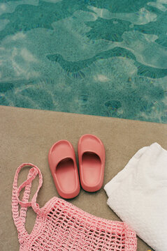 35mm Film photo pink slippers and bag by the pool