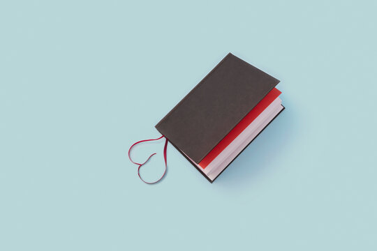 Blank book with bookmark shaped like a heart.