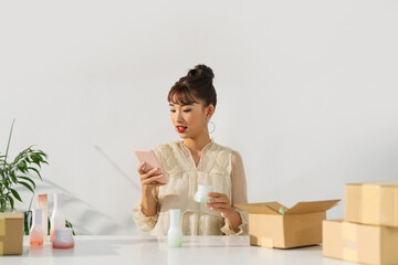 Business owner entrepreneur packing product in the box delivery