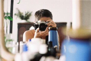 Woman's self portrait in vintage mirror 
