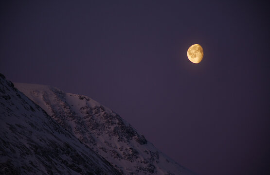 Waning gibbous moon and mountains