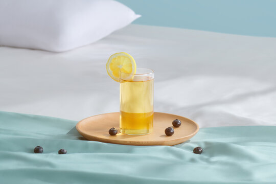 Wooden tray with delicious breakfast on bed