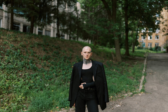 portrait of gay man wearing total black outdoors