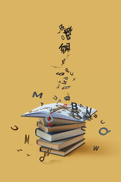 Black letters falling on pile of books.