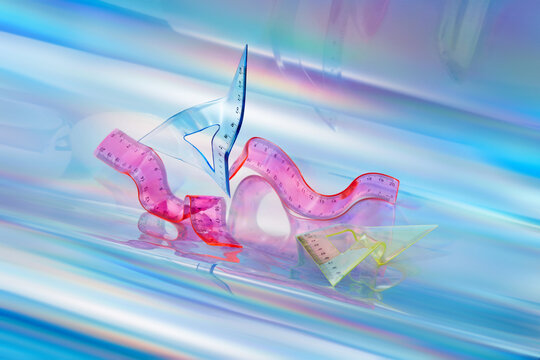 Molded rulers against iridescent background.