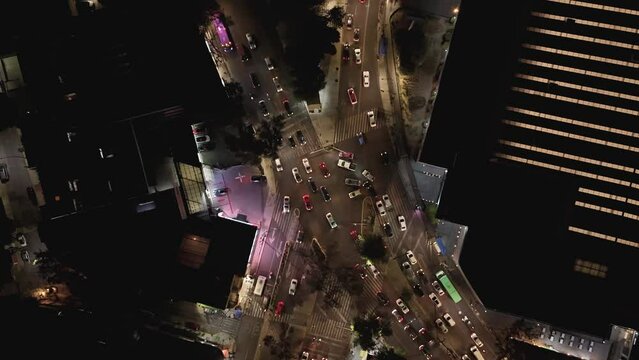 Aerial hyperlapse of a chaotic illuminated intersection in CDMX, night time