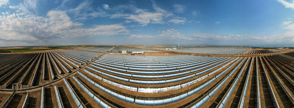 Parabolic trough solar power collectors - aerial drone wide panorama