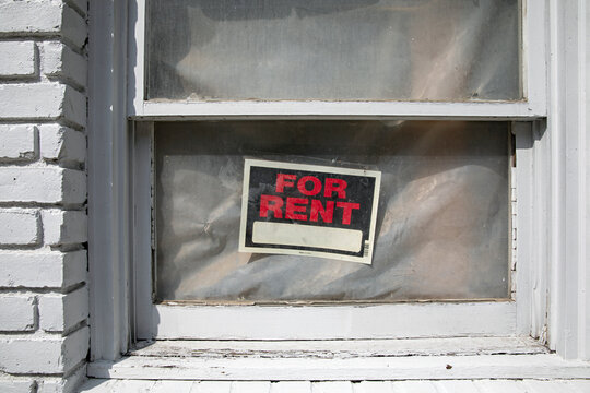 For rent sign in building window