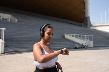 Sporty Woman Looking At Her Digital Watch