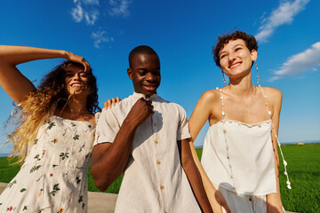 Group of diverse people near meadow