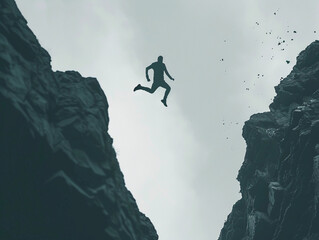 Silhouette of Enthusiastic man jumping between two cliffs in success and freedom concept 