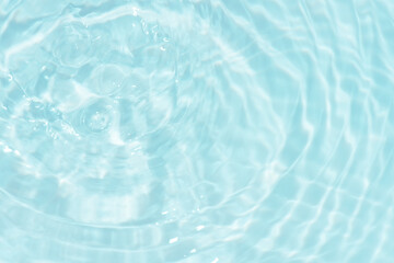 Blue water surface texture with ripples, splashes, and bubbles. Abstract summer banner background...